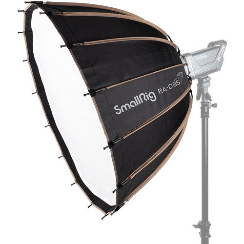 Parabolic softbox with black fabric and white interior, mounted on a studio light
