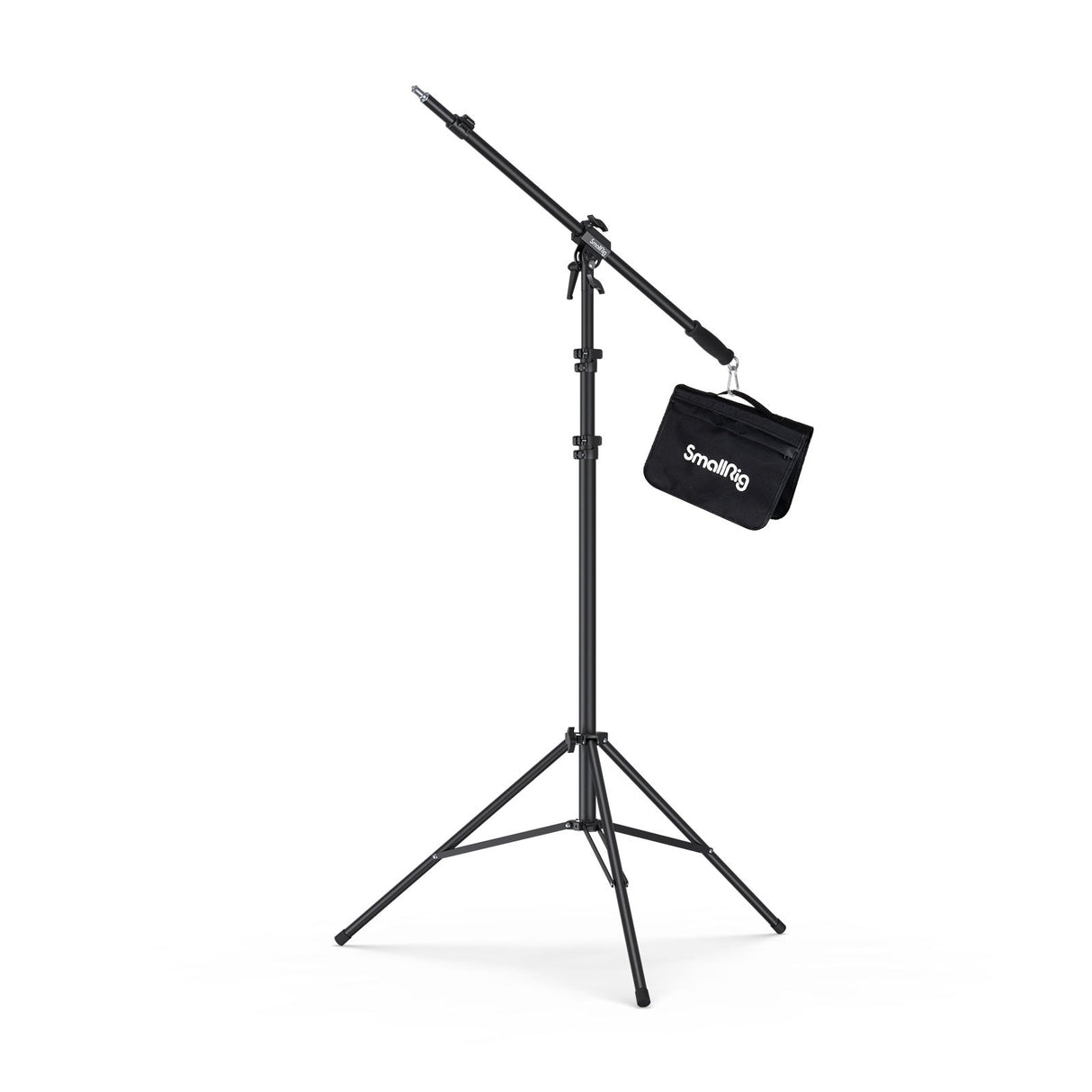 Pneumatic boom light stand with tripod base and hanging accessory bag