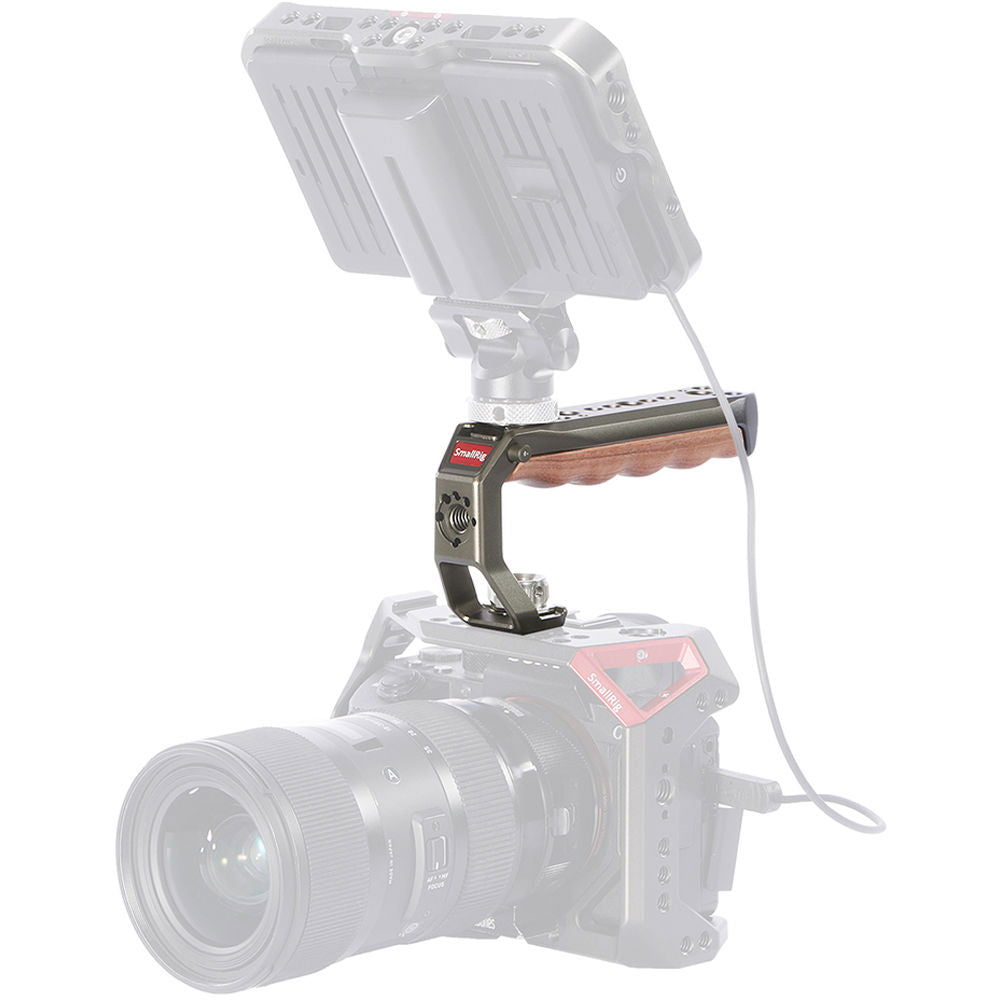 ARRI locating handle with wood grip and pin holes on camera rig