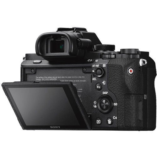Mirrorless camera angled view with rear LCD open and top dials