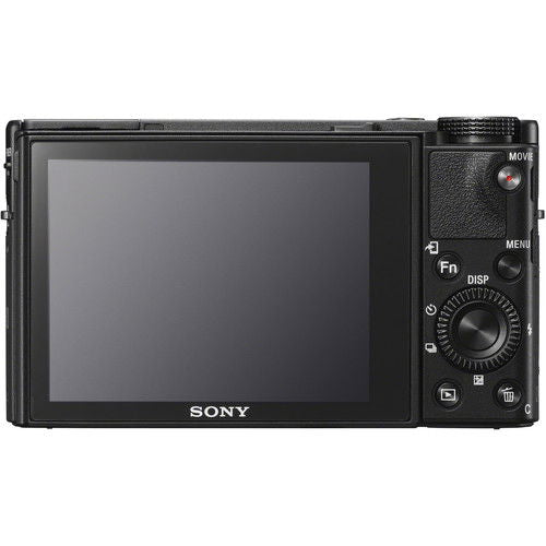 Rear view of black compact camera with LCD screen and control buttons