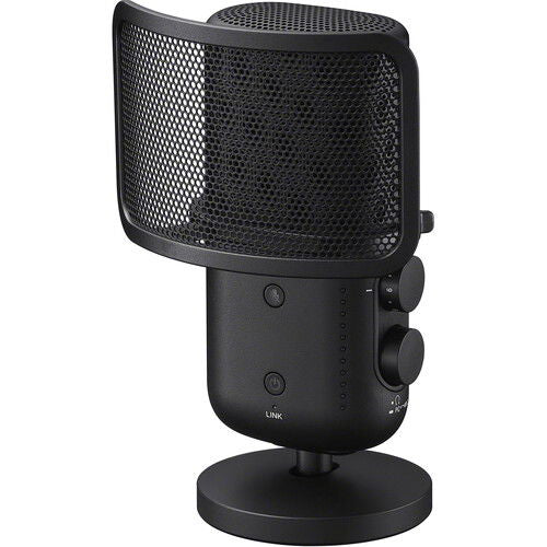 Black wireless microphone with grille mesh and side control knobs on stand