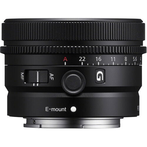 Black lens top view with E-mount label, mode switch, and aperture scale