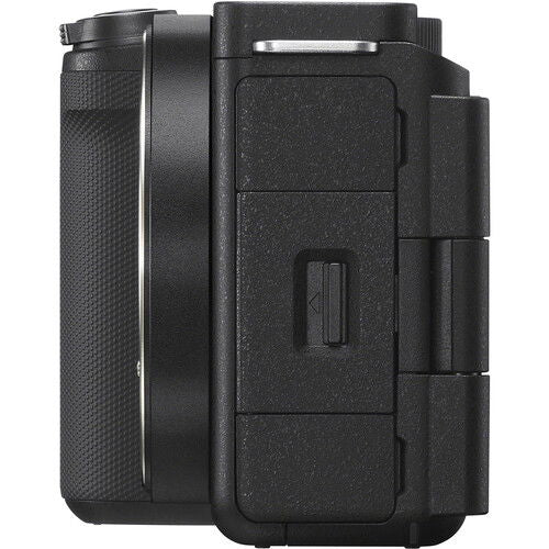 Black mirrorless camera body side with access door and textured grip