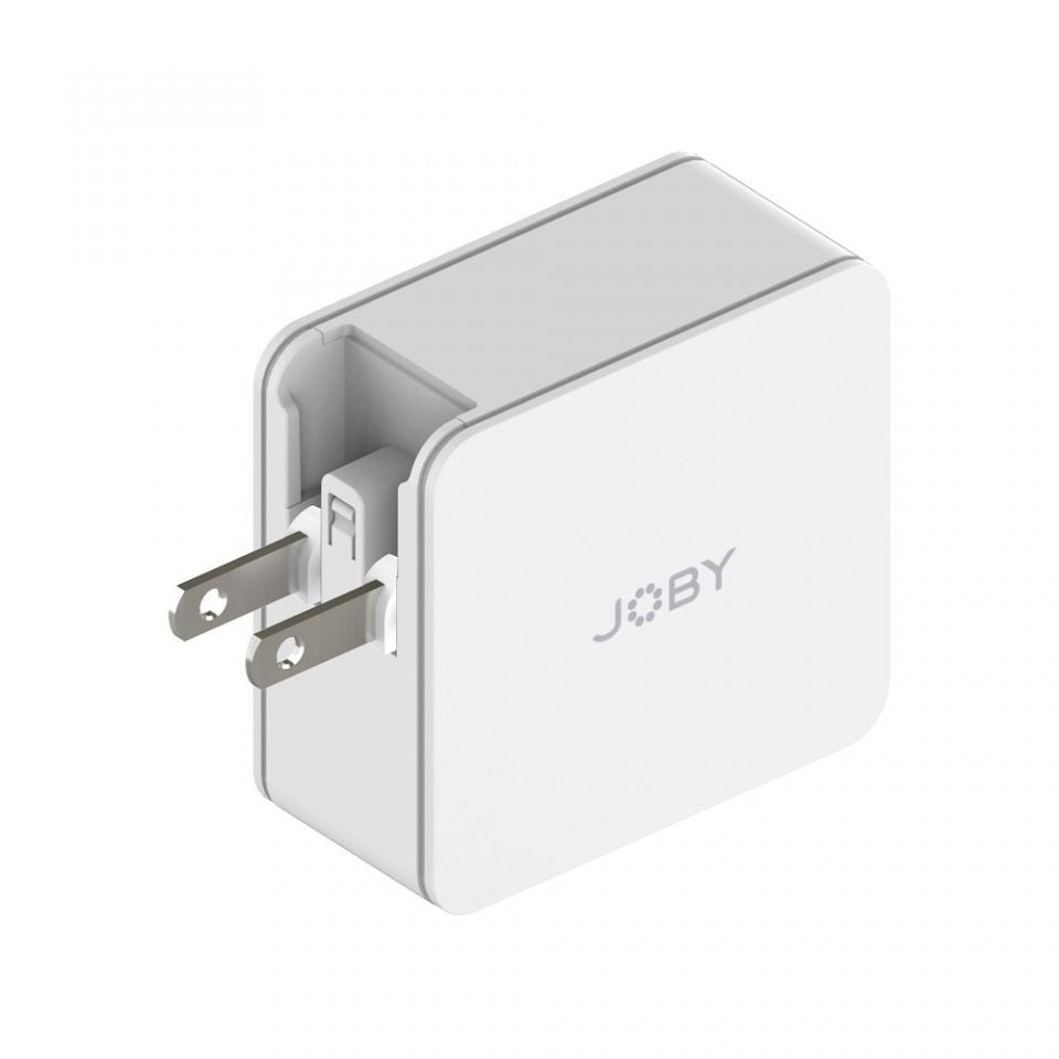 Dual-port wall charger plug side view, white body with exposed metal prongs