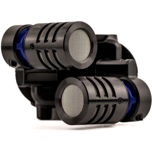 Close-up of dual microphone heads on handheld audio recorder with blue accents