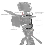 Camera cage on tripod rig, showing side handle, matte box area, and follow-focus section
