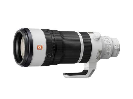 White and black 100-400mm telephoto lens, front element and hood visible