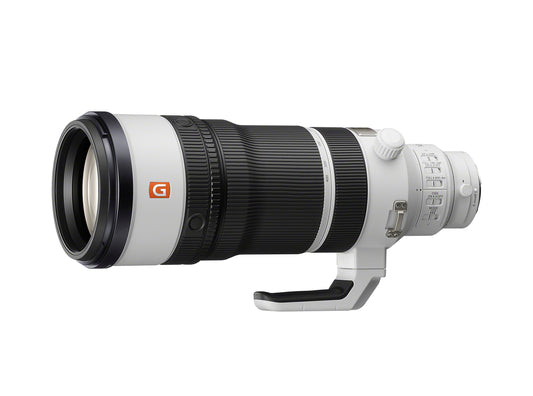 White and black 100-400mm telephoto lens, front element and hood visible
