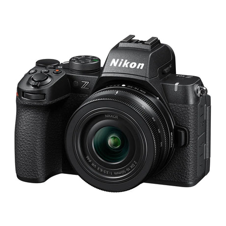Black mirrorless camera front view with NIKKOR 16-50mm VR lens attached