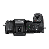 Mirrorless camera top view with mode dial and command controls