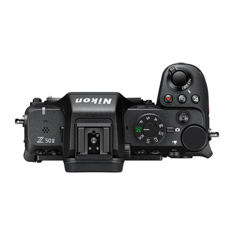 Mirrorless camera top view with mode dial and command controls