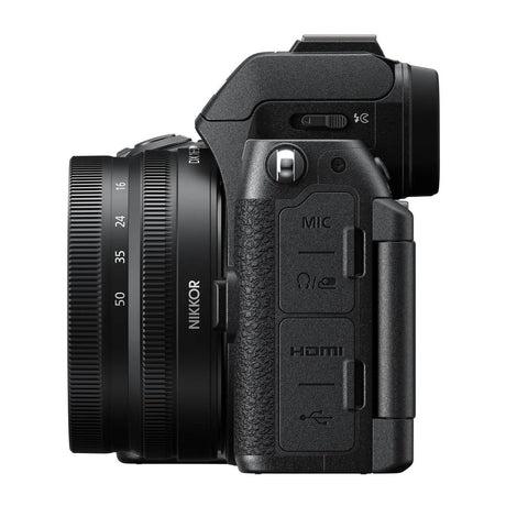 Camera side close-up with MIC and HDMI ports next to 16-50mm lens barrel