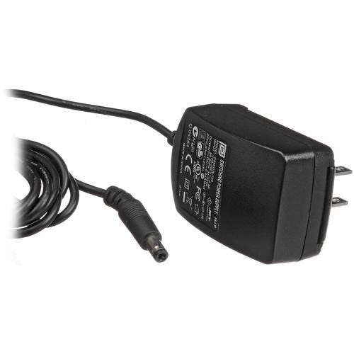 Mini power converter/transformer with black body and attached DC barrel plug cable