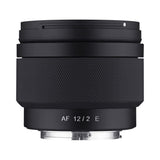 Obiectiv foto negru cu inel texturat și marcaje „AF 12/2 E” pe corp
