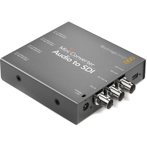 Mini audio to SDI converter with BNC connectors and power port, black metal