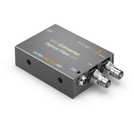 Mini Converter Optical Fiber 12G, top view with dark metal case and two coax connectors