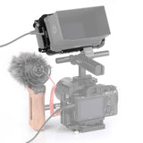 Atomos Ninja V 5in cage mounted on camera with screen cover and microphone
