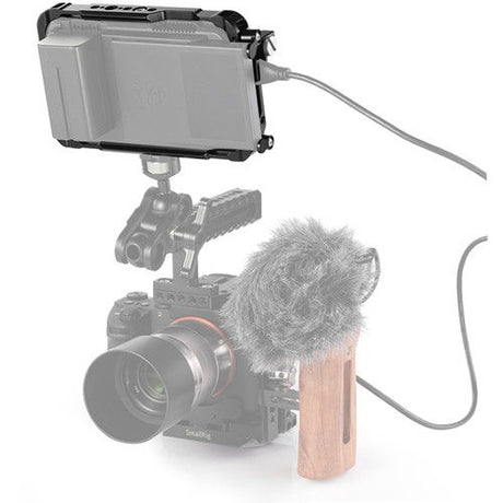 Ninja V 5in cage with rear connections and cable routing; mounted on camera