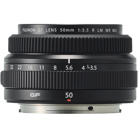 Black 50mm f/3.5 lens front view, ribbed rings and aperture markings on barrel