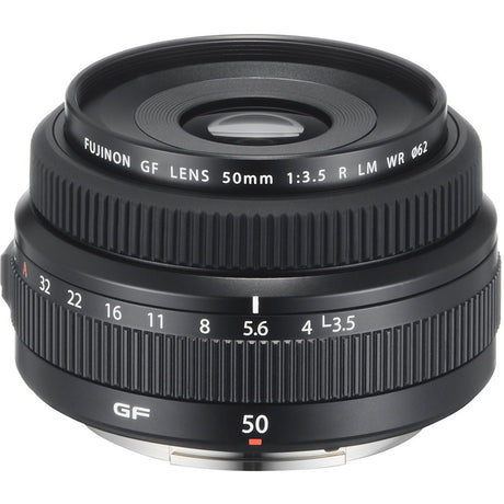 Black 50mm f/3.5 lens with front element opening and engraved focus/aperture rings