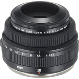 Black 50mm f/3.5 lens side view with ribbed grip, aperture ring numbers, and base rim
