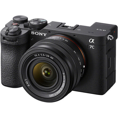 Black mirrorless camera with 28–60mm lens, front view