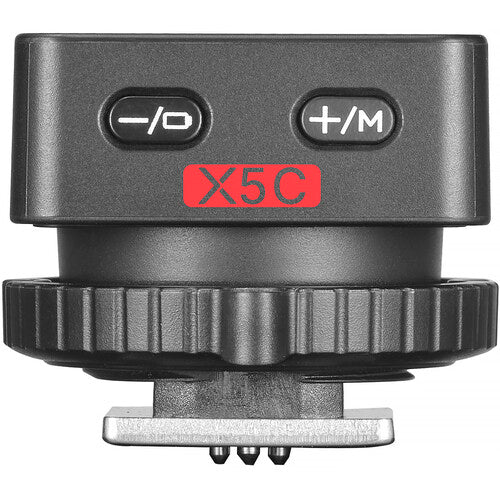 Wireless X5C transmitter for Canon, showing -/0 and +/M buttons on dark body