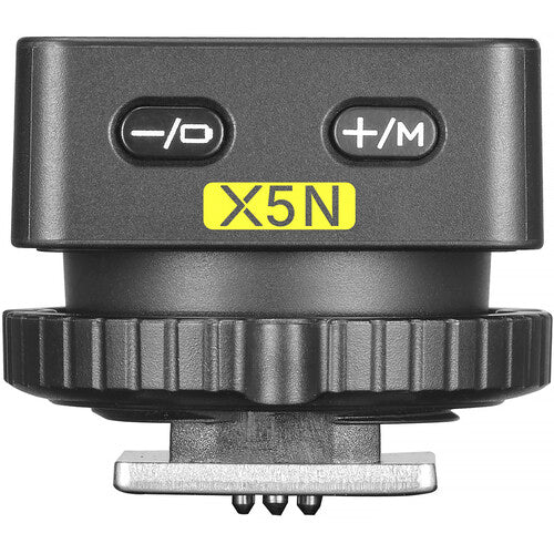 Wireless flash trigger transmitter with -/O and +/M buttons, labeled X5N, dark gray