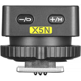 Wireless flash trigger transmitter with -/O and +/M buttons, labeled X5N, dark gray
