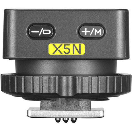 Wireless flash trigger transmitter with -/O and +/M buttons, labeled X5N, dark gray