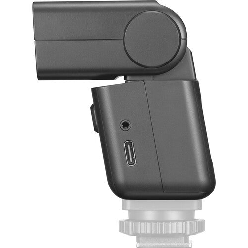 Dark mini TTL speedlite side with USB port and compact open head