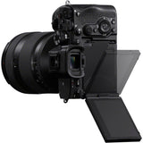 Mirrorless camera body with lens, tilting LCD screen and control dials