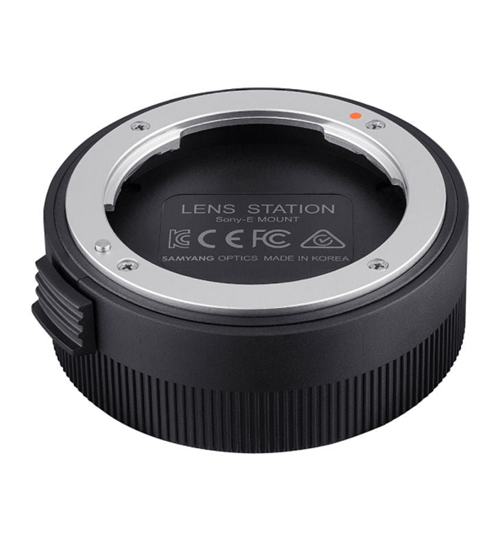Circular USB dock with metal mount ring and black ribbed base for Sony E cameras