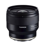 Black Tamron 24mm f/2.8 Di III OSD lens barrel with textured sides