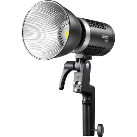 Bi-color LED lamp with silver reflector, black handheld grip, hot-shoe mount