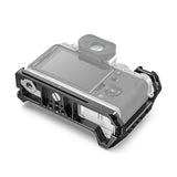Black camera cage mounted on Fujifilm X-T4 body with front cutouts and side ports