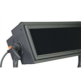 Black light control on side with orange button; vented front grille visible