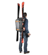 Side view worn grey camera backpack with orange trim and adjustable shoulder straps