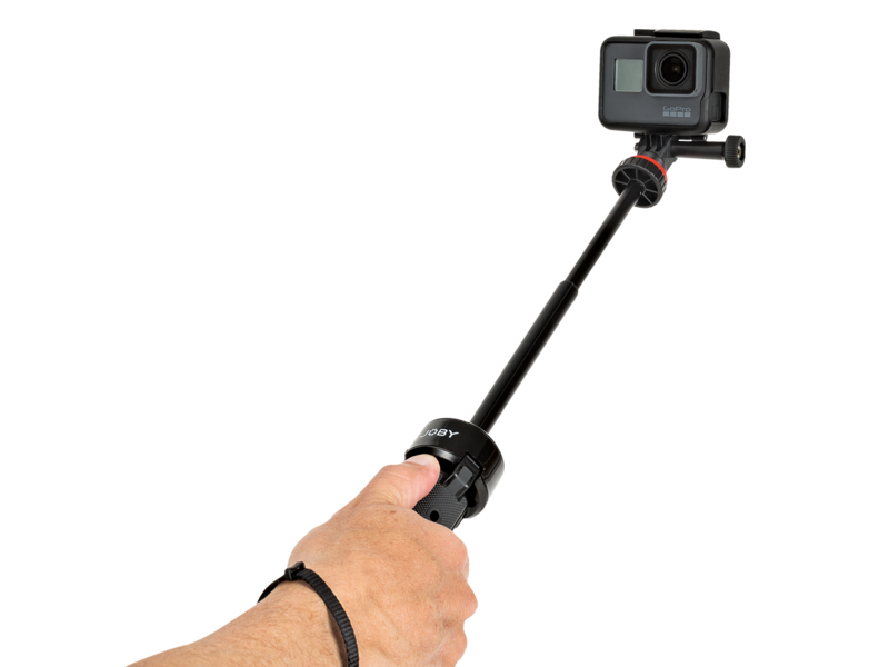 Minitrepied telescopic ținut în mână, cu cameră montată deasupra