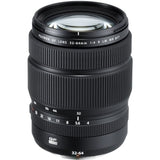 32-64mm mirrorless zoom lens in black, front barrel markings and filter rim
