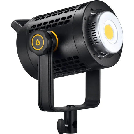 Black LED video light head with yellow power button, silver reflector, mounted on stand