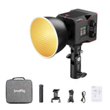 Bi-color LED video light with black housing and wide reflector head, plus included accessories