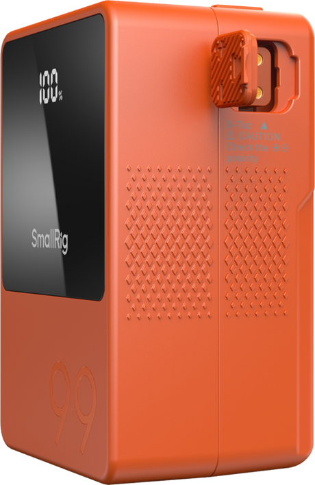 Orange V-mount battery side view with textured vent pattern and LCD panel