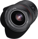 Diagonal view of black AF 24mm f/1.8 FE lens with front glass element and grip ring