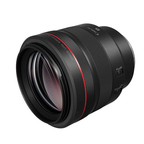 Side view of black RF85mm f/1.2 lens, glass front and AF/IS labels visible