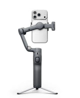 Dark gray gimbal with phone holder showing dual rear cameras, on tripod legs