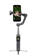 Phone-mounted gimbal stabilizer with extended handle and tripod legs, dark gray