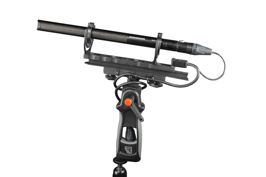 CB1 XLR-3F connector box on handheld grip, black cables leading to XLR outputs.