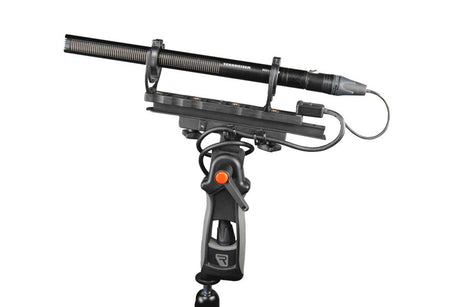 CB1 XLR-3F connector box on handheld grip, black cables leading to XLR outputs.